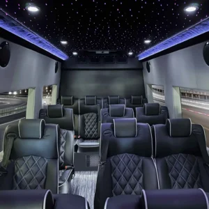 Supreme Sprinter Shuttle 23-030 interior with black leather seats, ambient lights, and nighttime highway view.