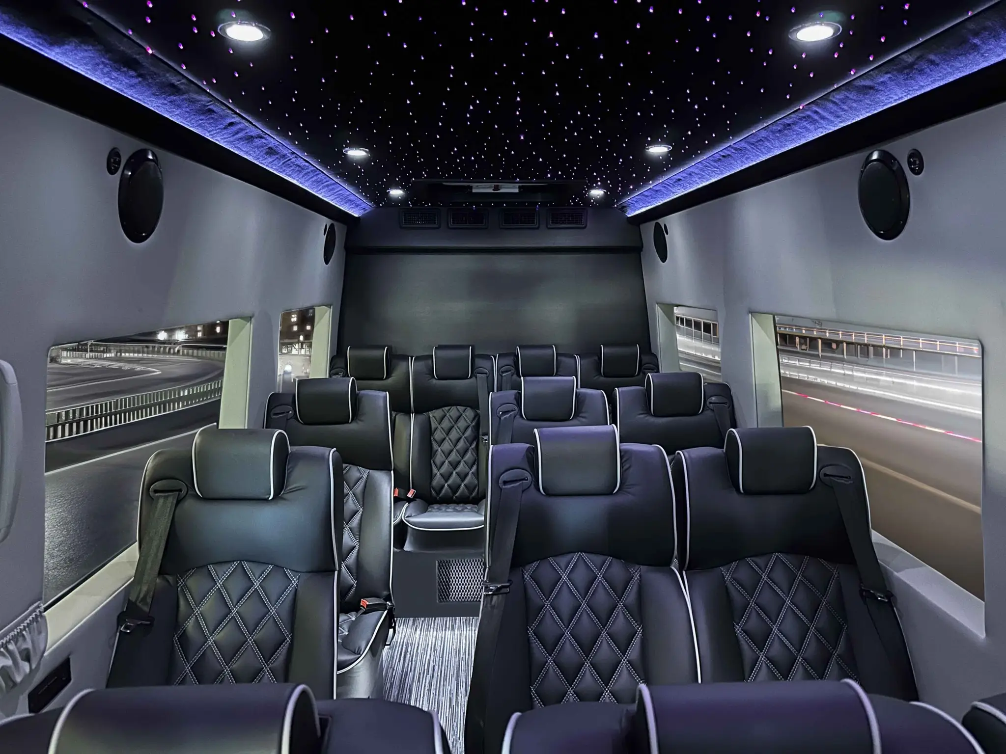 Supreme Sprinter Shuttle 23-030 interior with black leather seats, ambient lights, and nighttime highway view.