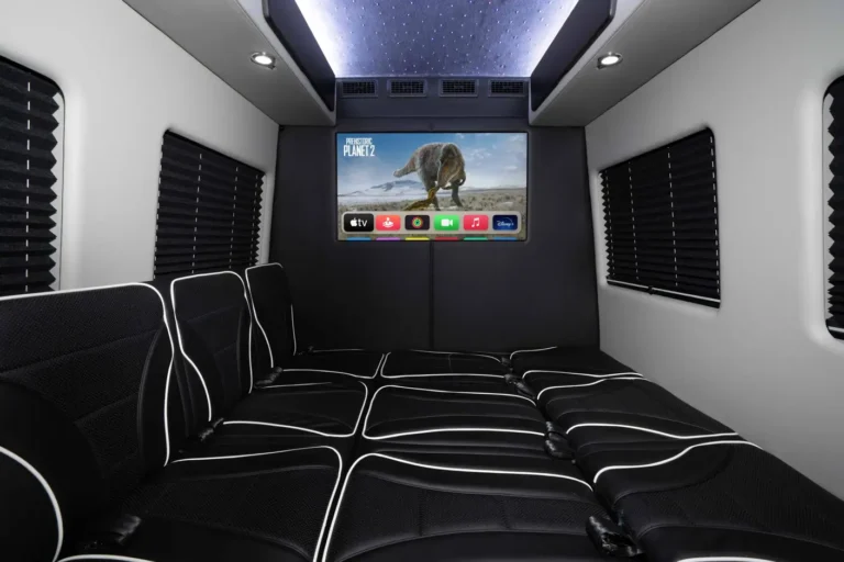 Sprinter van interior with mounted TV, showcasing sprinter TV mount setup