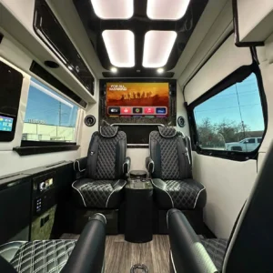 Midwest Patriot Cruiser luxury van interior with quilted leather seats and Apple TV