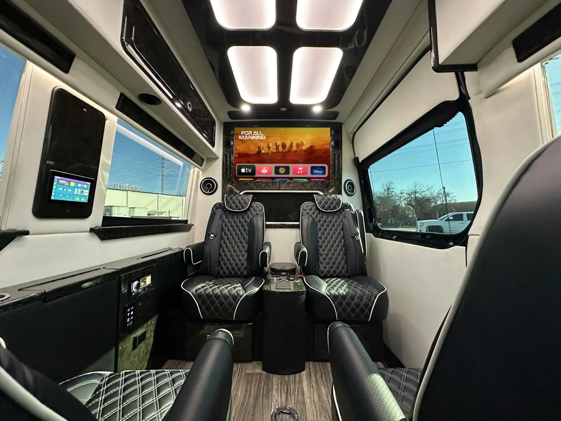 Midwest Patriot Cruiser luxury van interior with quilted leather seats and Apple TV