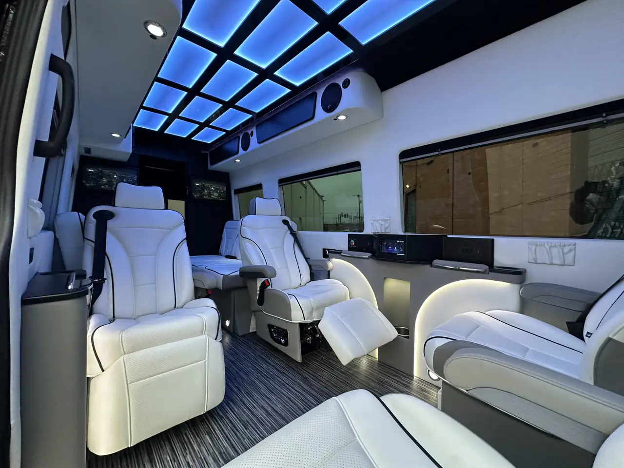 Luxury athlete transport van with premium leather seating and LED ceiling lighting